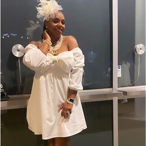 Beautiful White dress with a huge big bow.